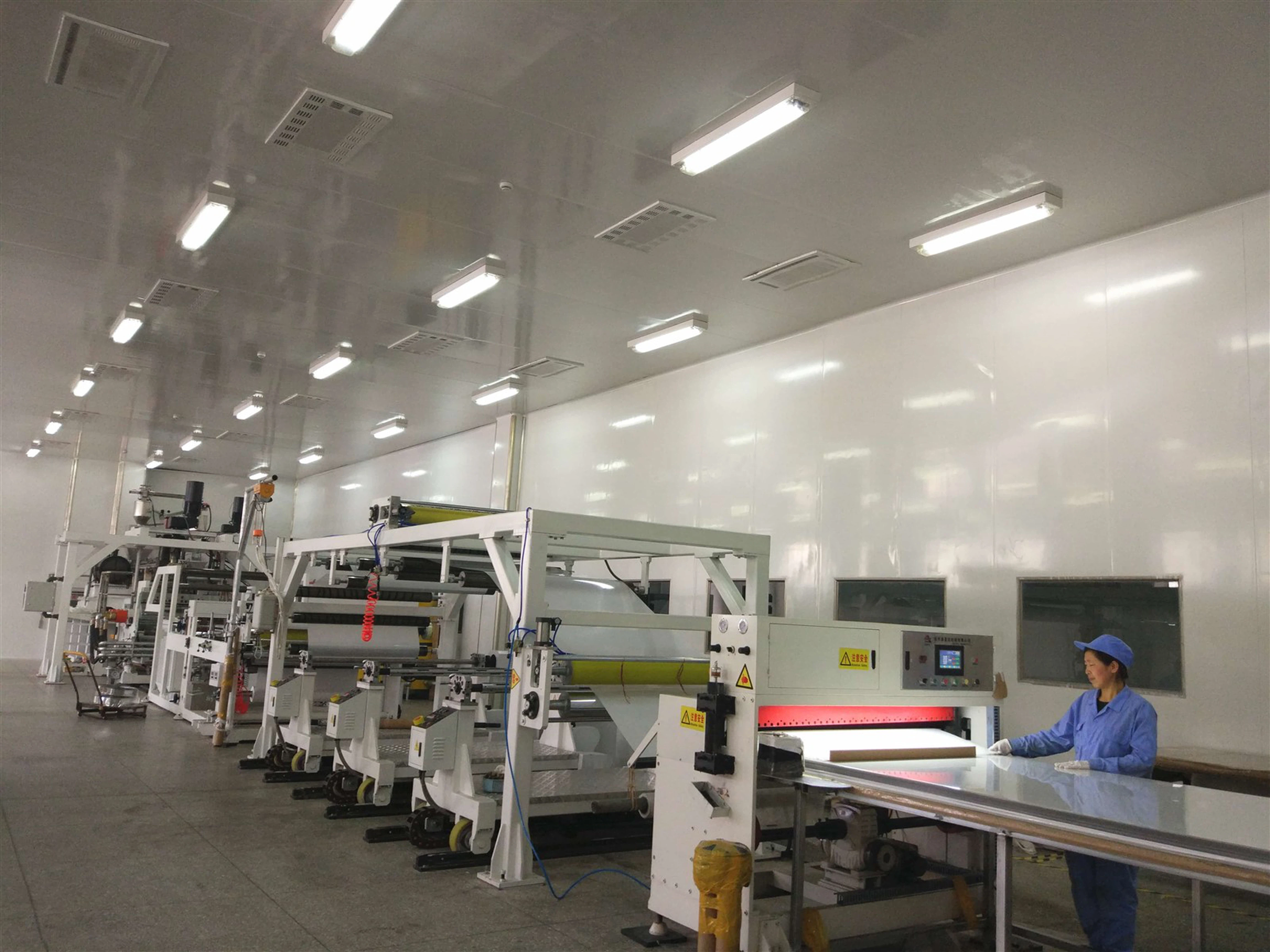 Calendering line for PVC sheets ensuring uniform thickness and high-quality surface finish Calendering line for PVC sheets ensuring uniform thickness and high-quality surface finish